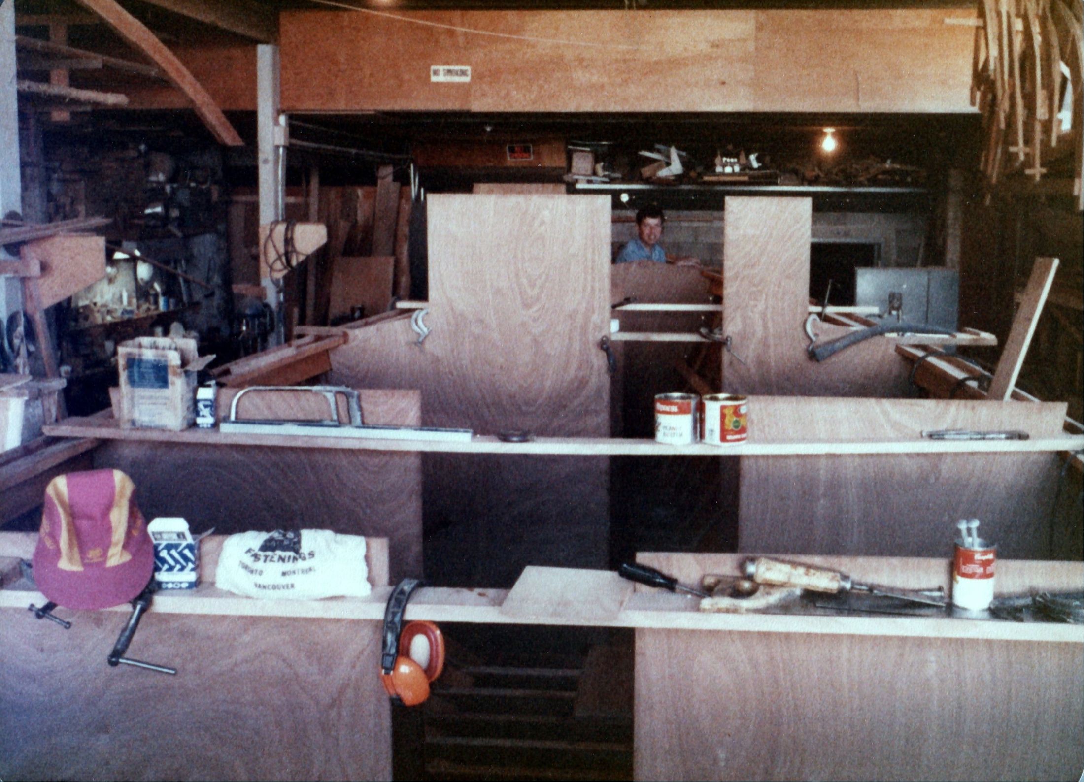 Interior joinery under way, paint cans on the bench