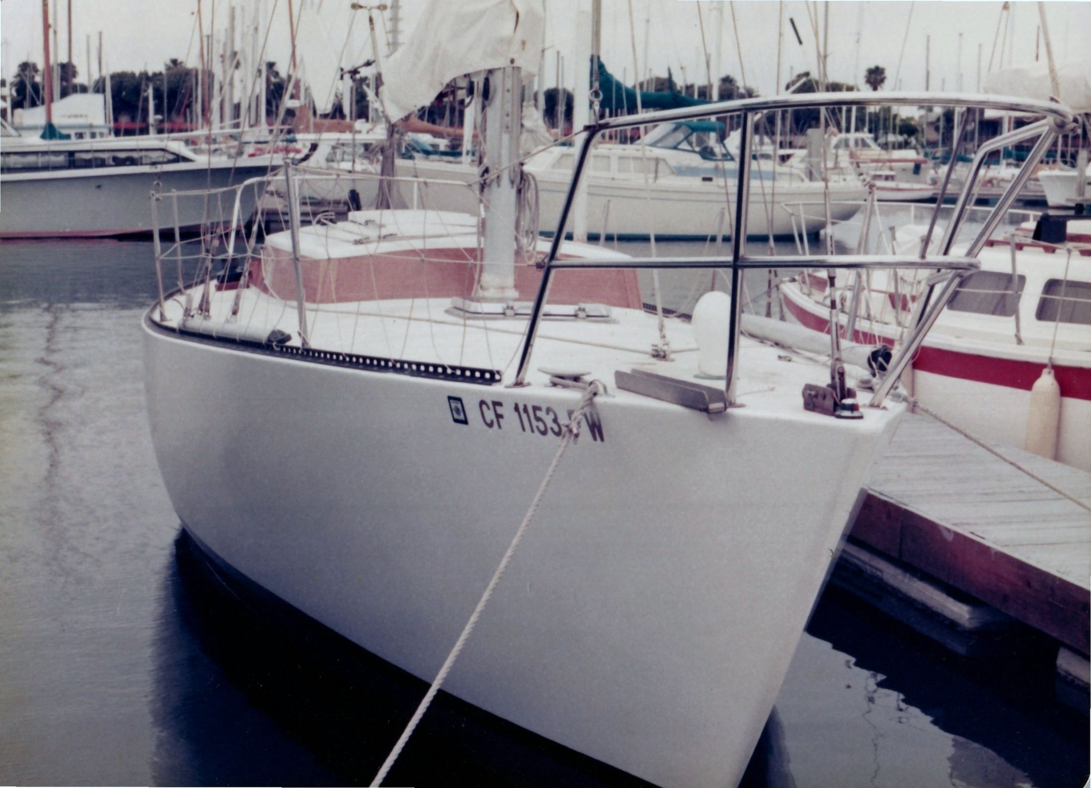 A Peterson 33 at a marina dock, bow on