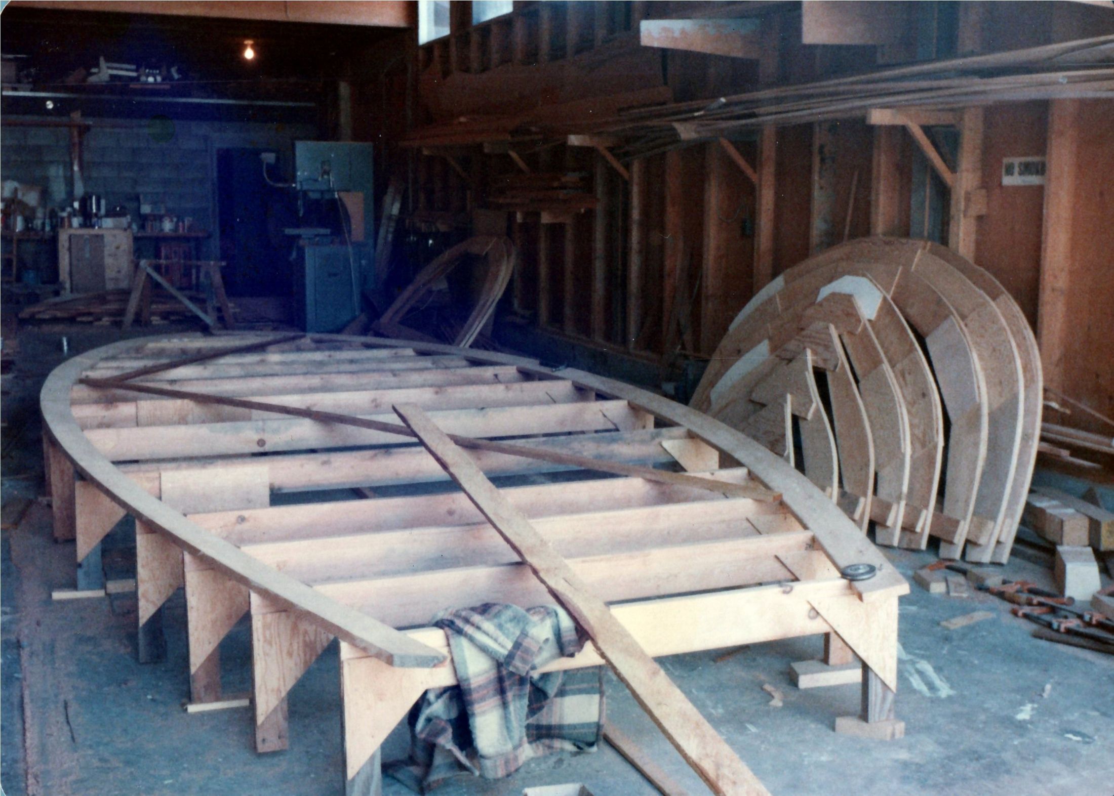 The strongback with the station molds set up along it, upside down