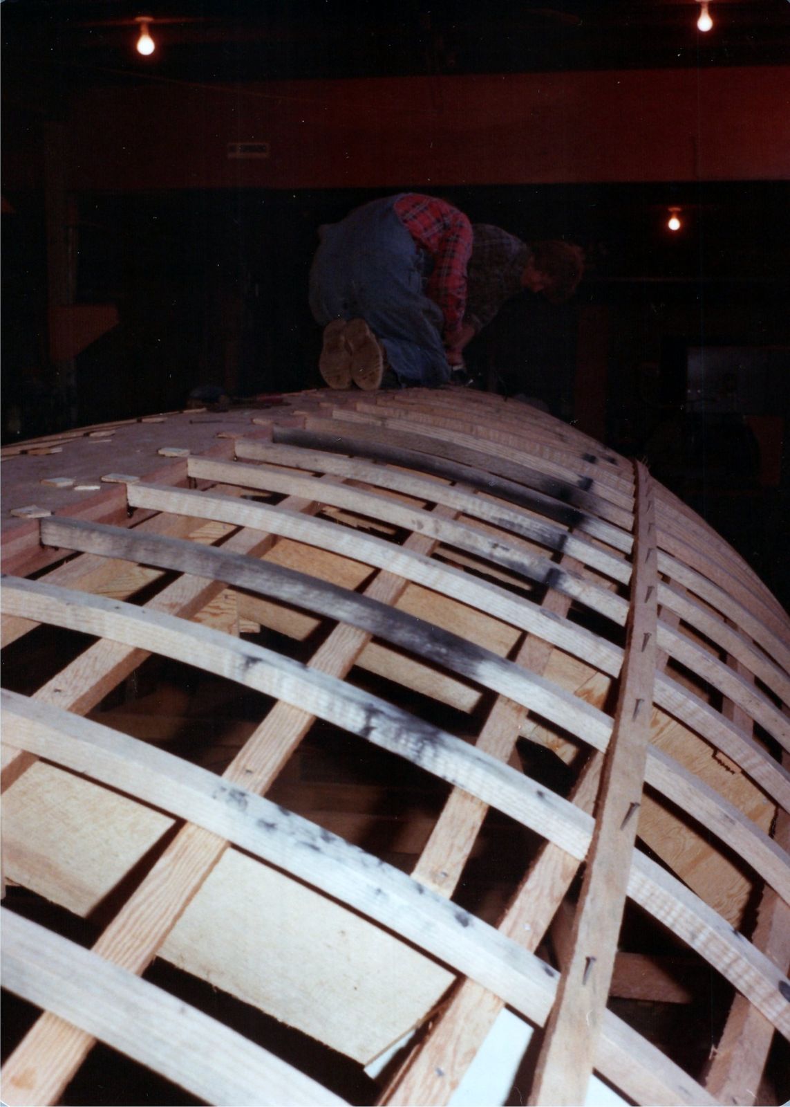 A man working at the after end of the frames