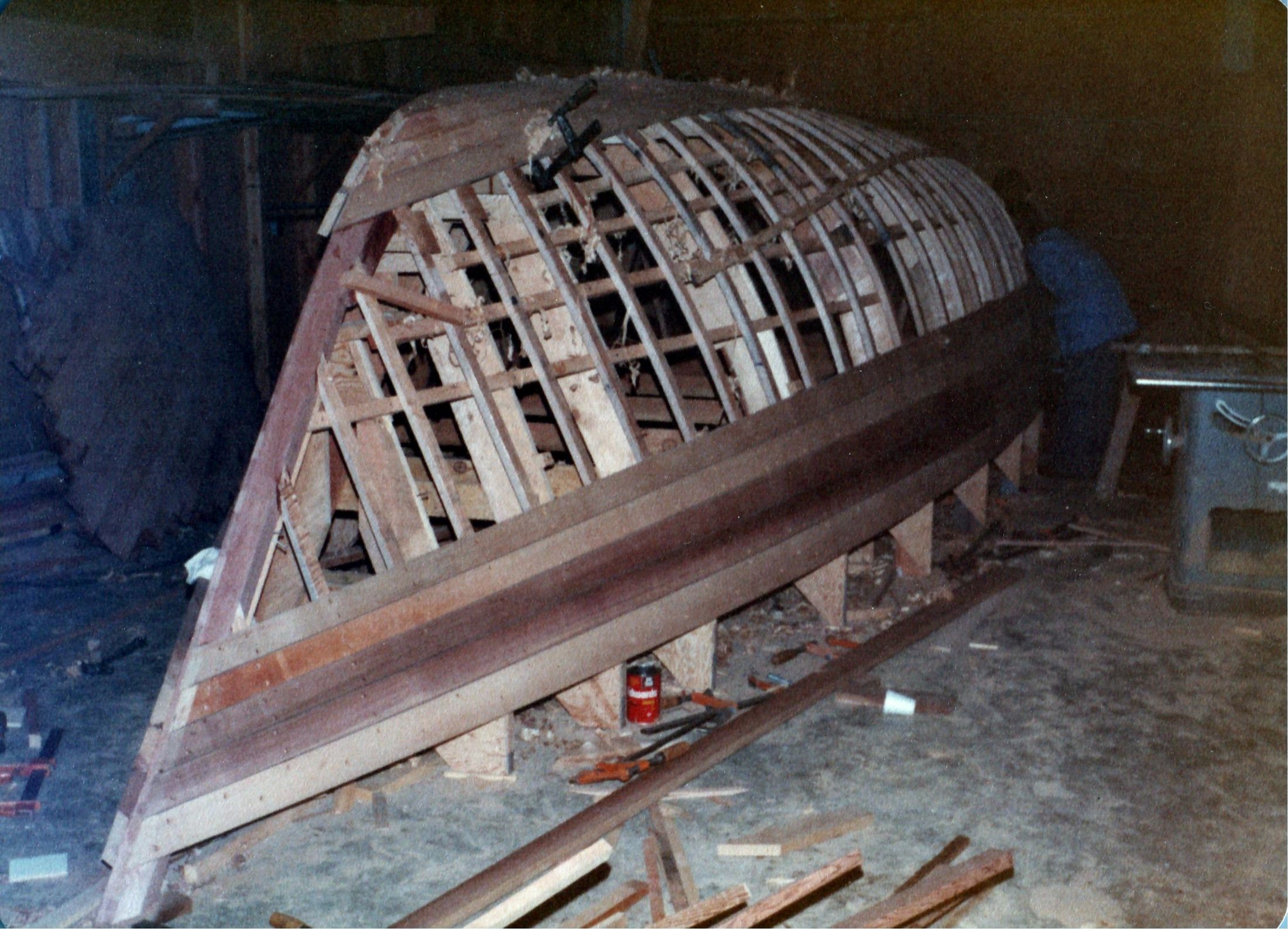 The hull half planked, the bare stringers still showing at the keel