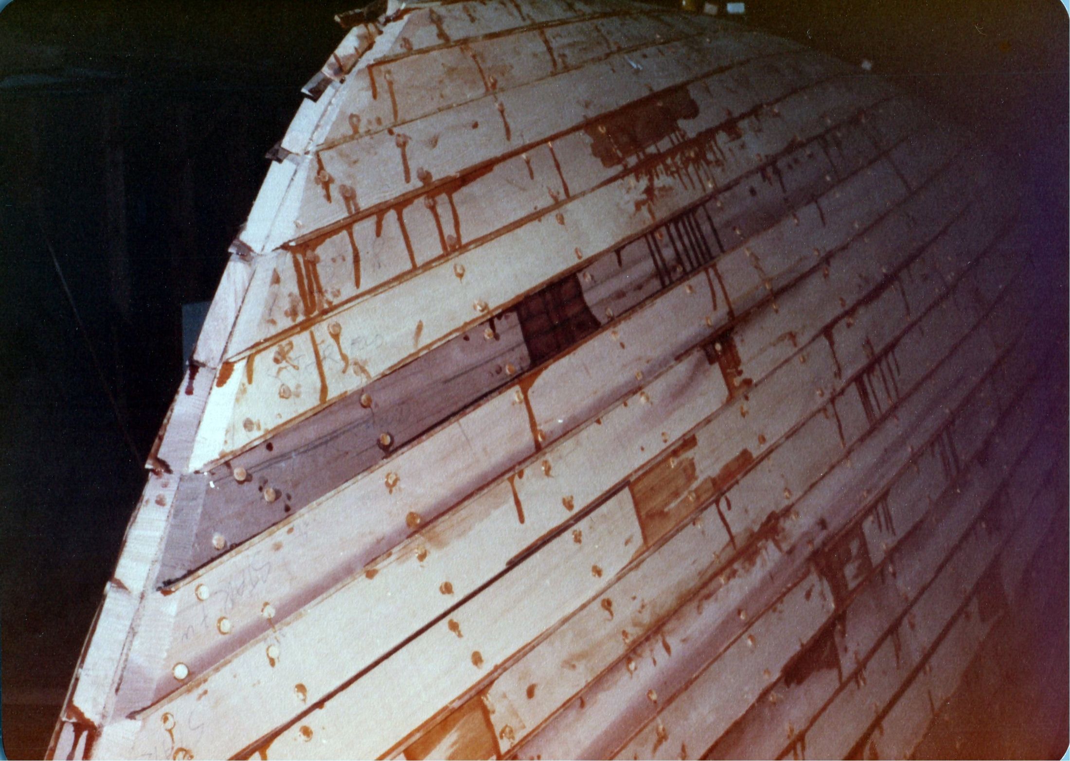 The planked hull with butt blocks and fastening lines, glue squeezed from the seams