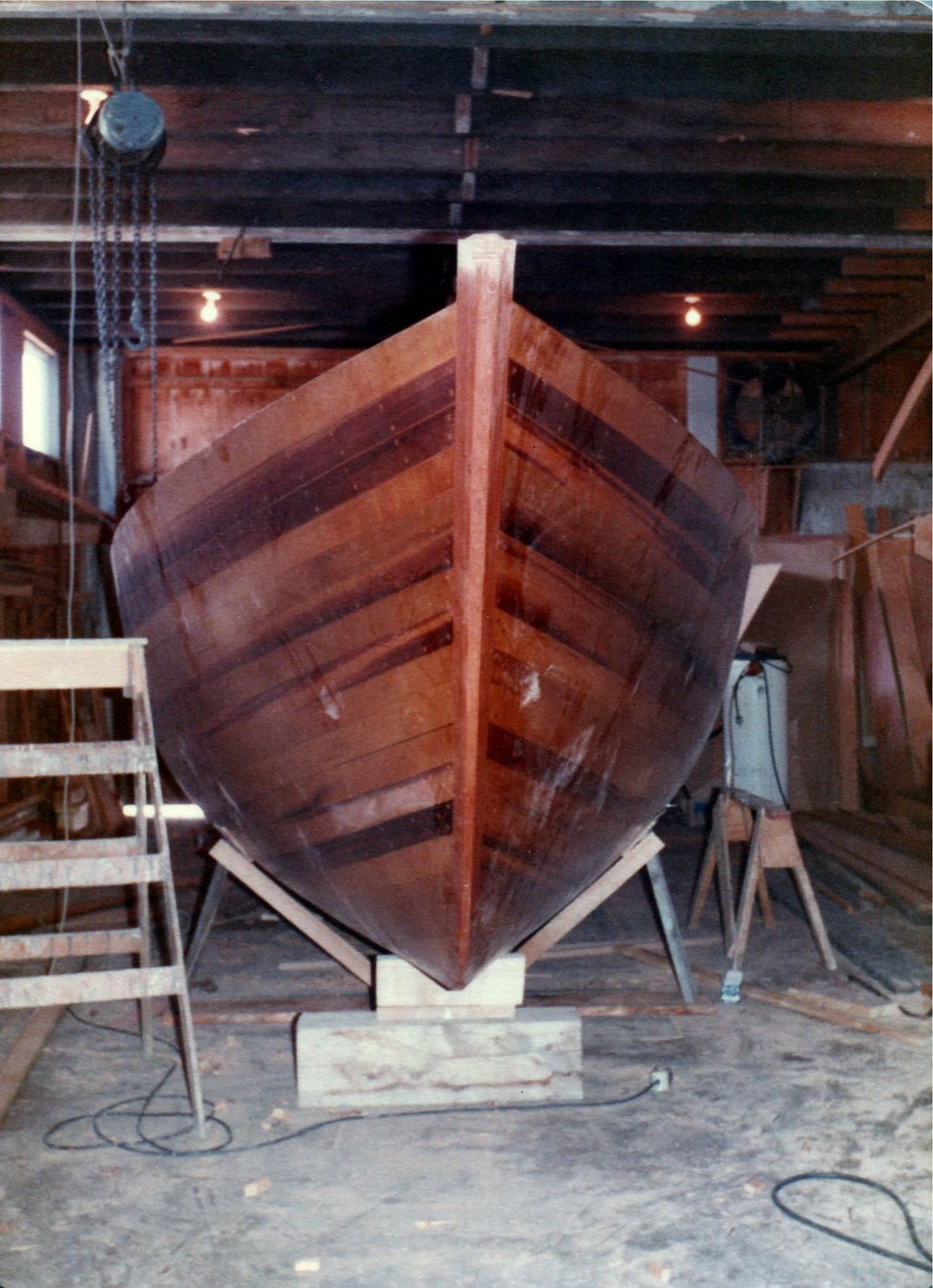 The upright hull from the bow, resting on its stub keel