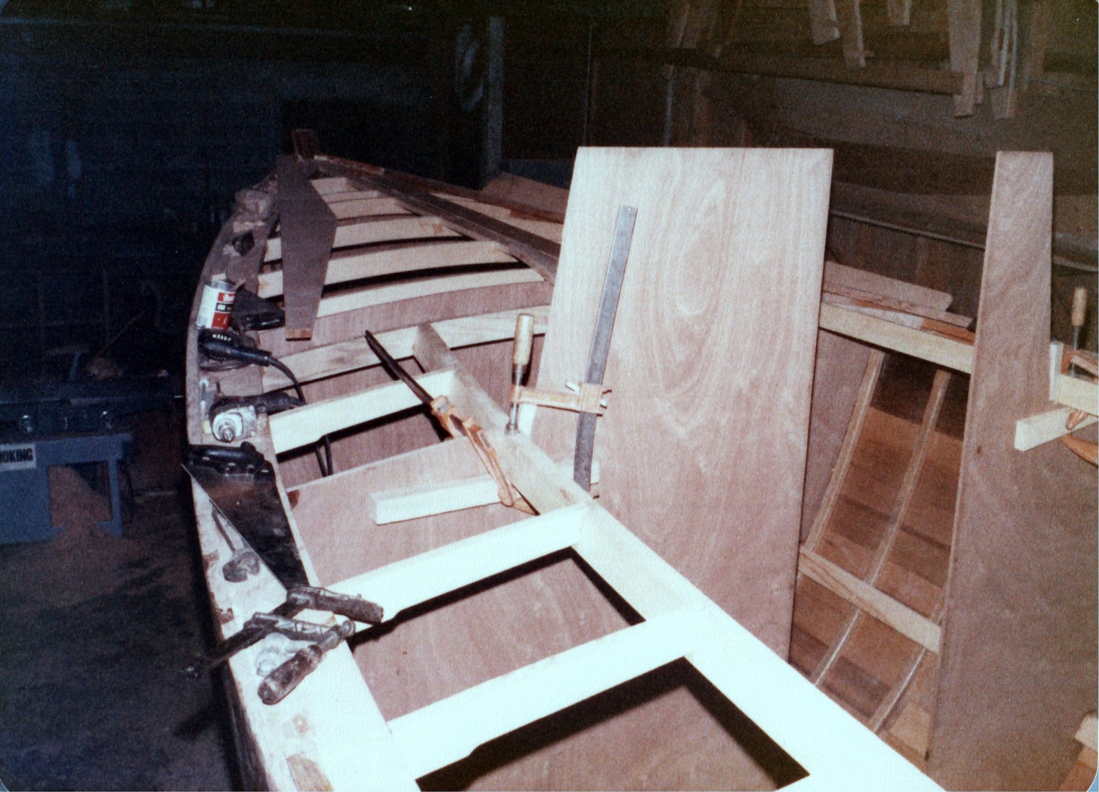 Deck beams notched into the shelf, clamps holding a carling