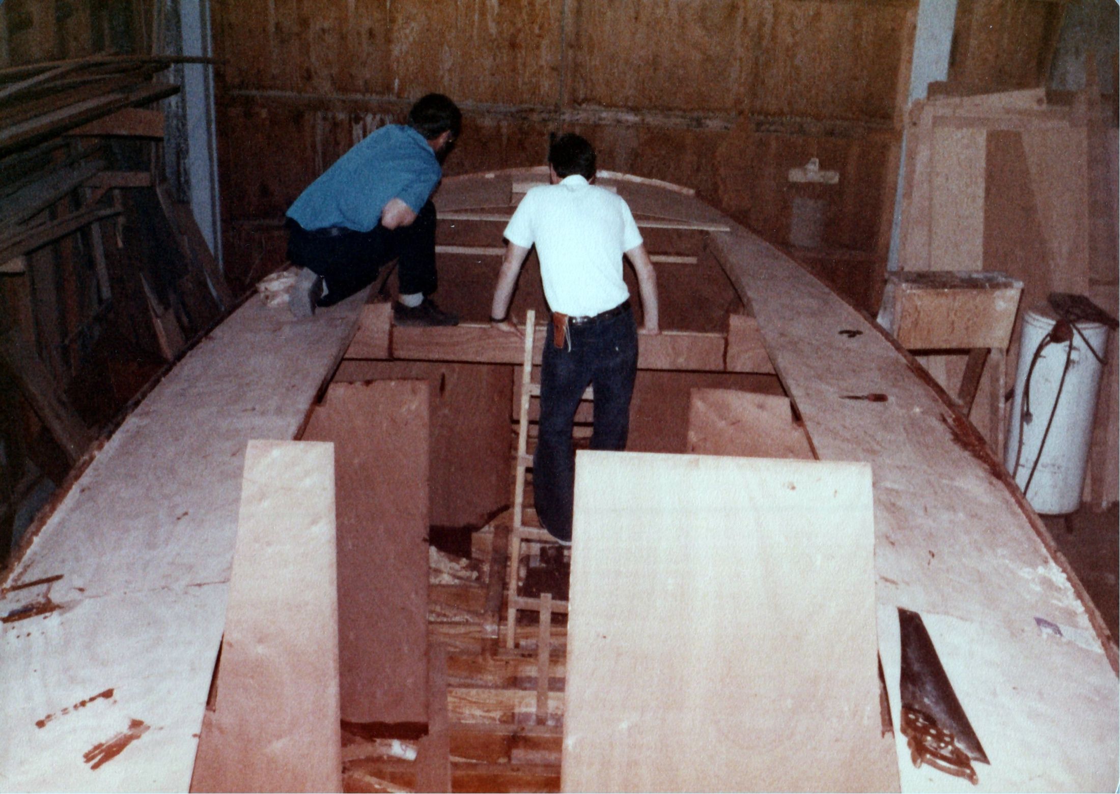 Two men working on the deck framing