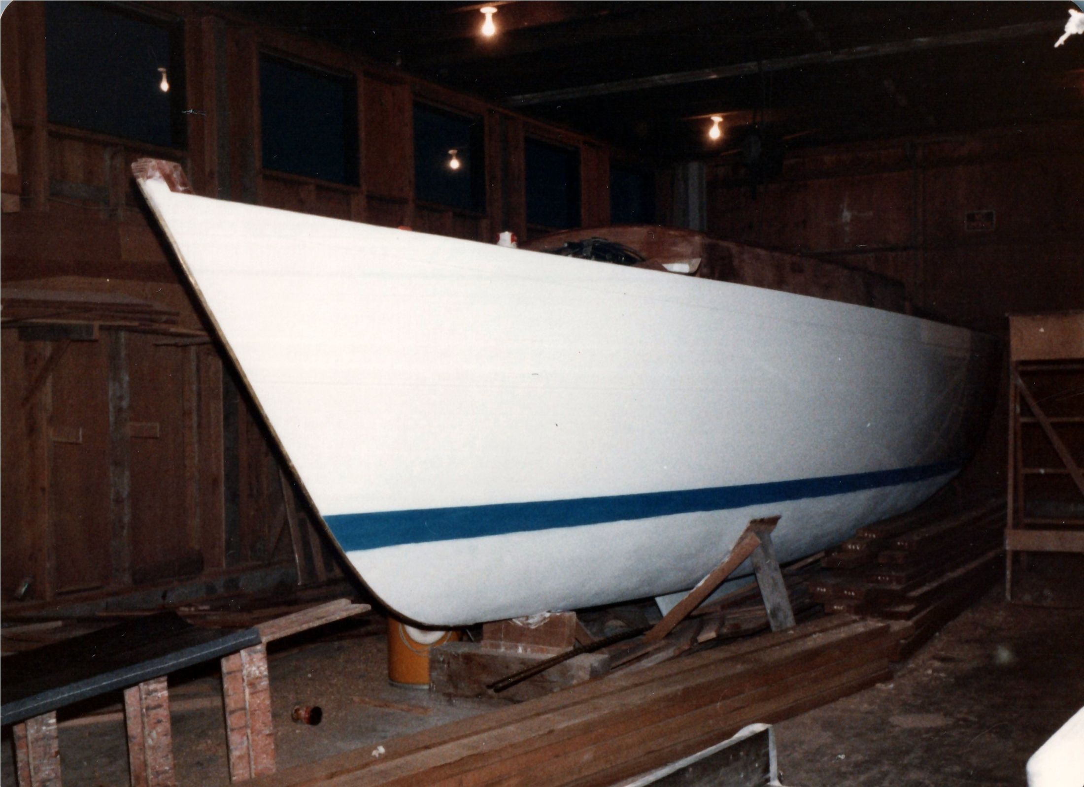 The hull painted white with the boot top struck in blue
