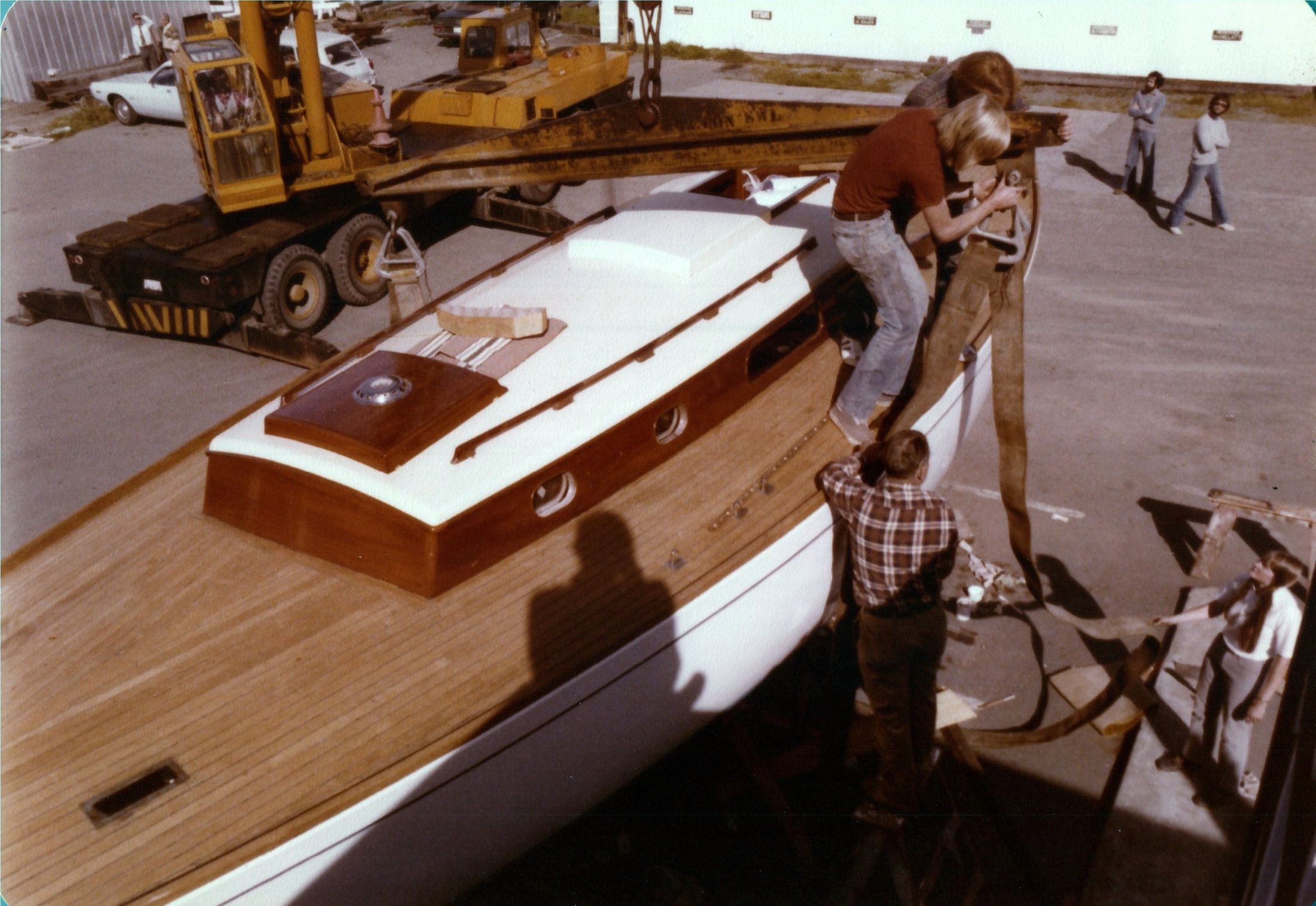From the foredeck: the crane, the teak deck and the varnished coach house