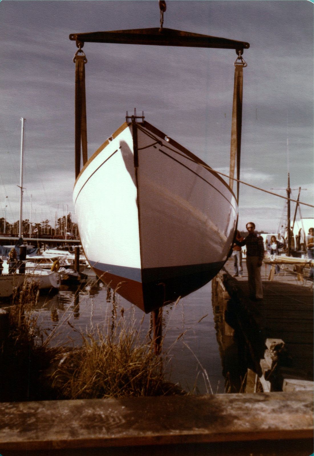 The bow from below, hanging in the slings above the water