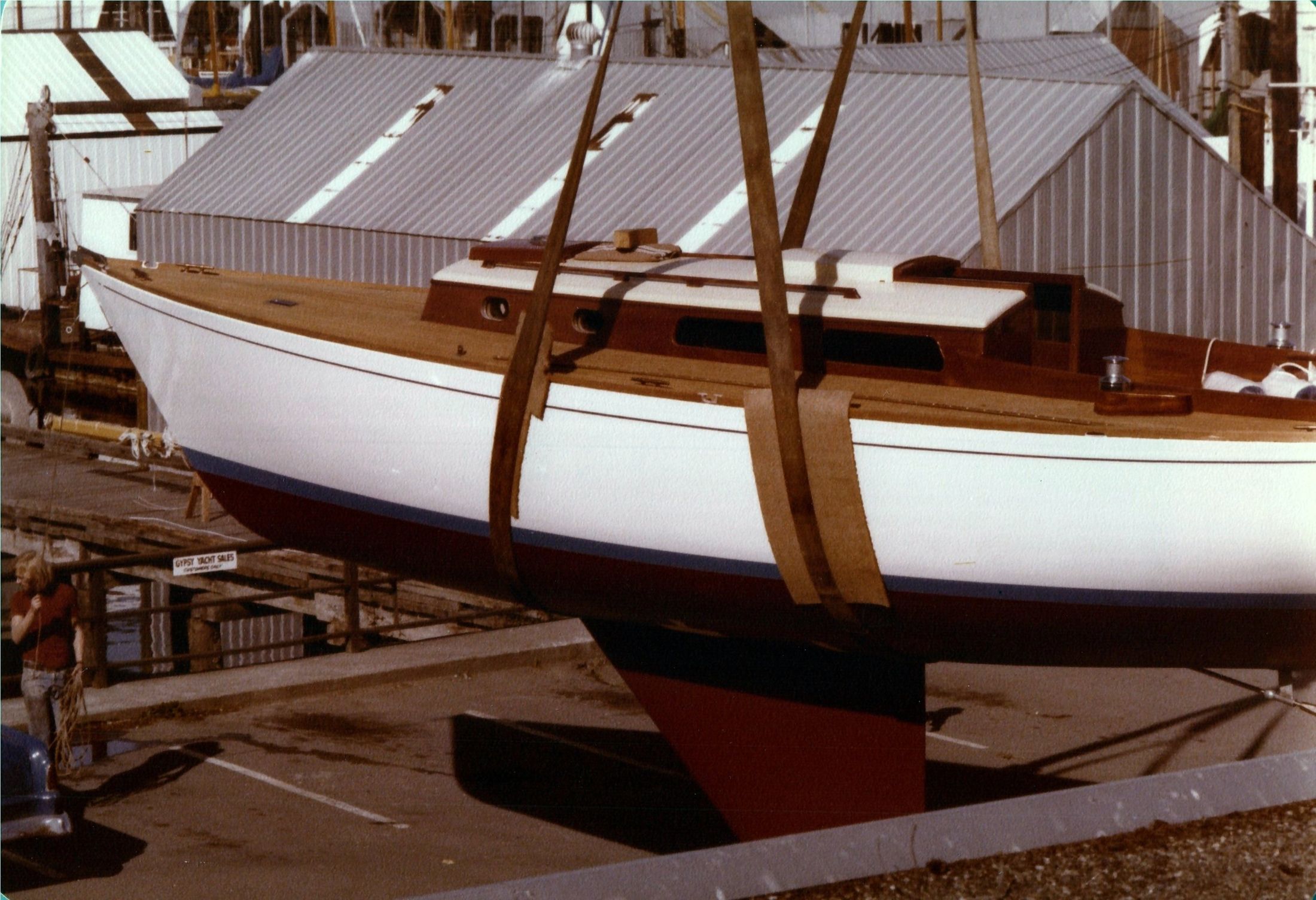 Jura in the slings beside the boathouse, the mast not yet stepped