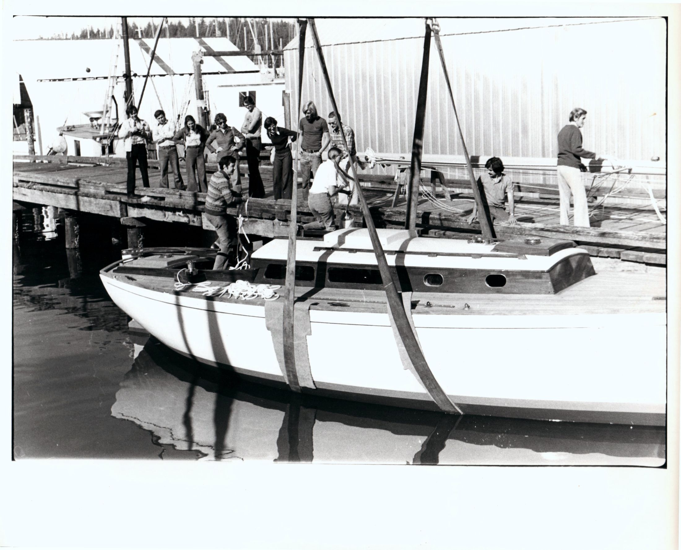 Black and white: Jura alongside the dock, people on the float