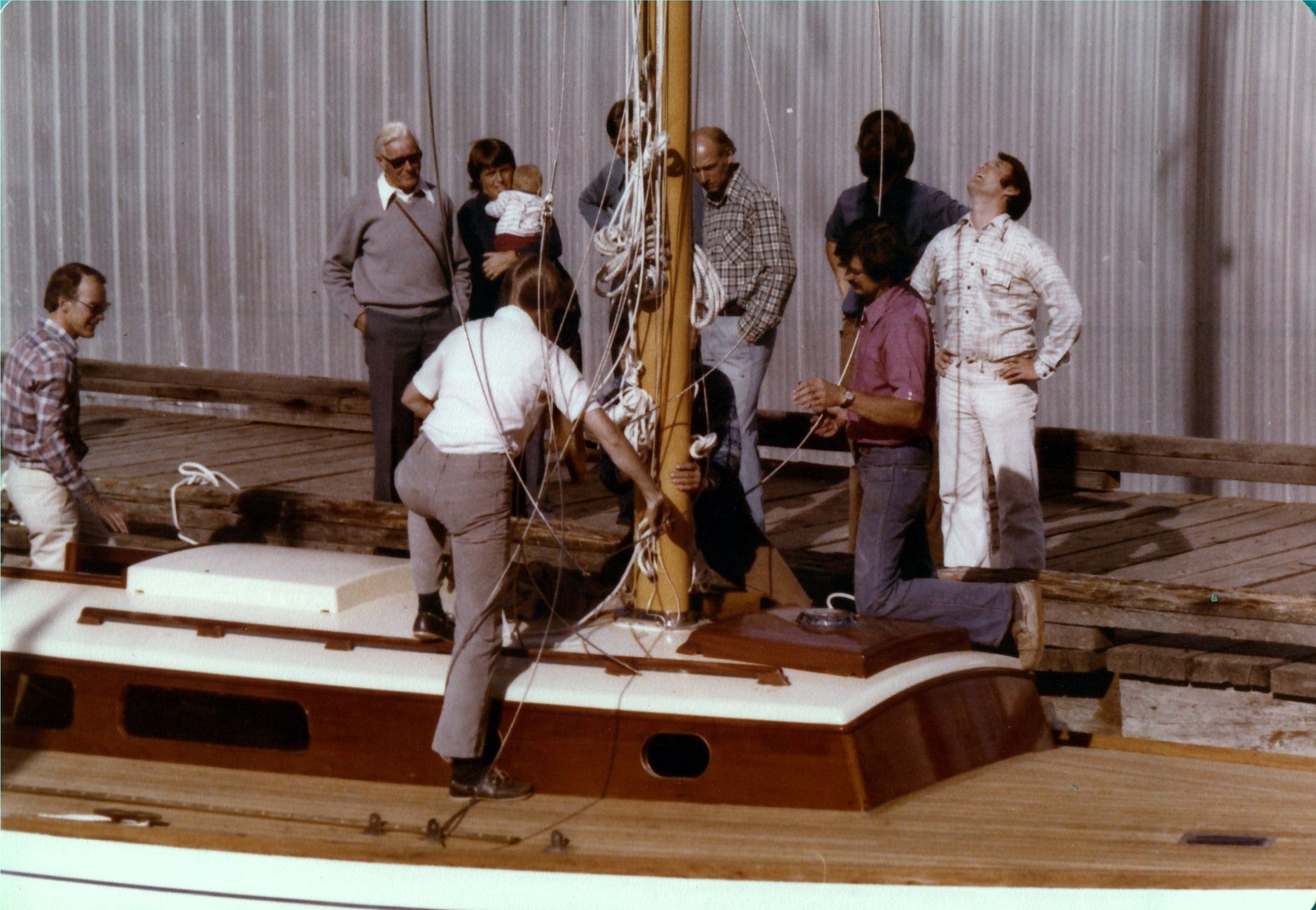 The rigging crew on the dock beside the mast