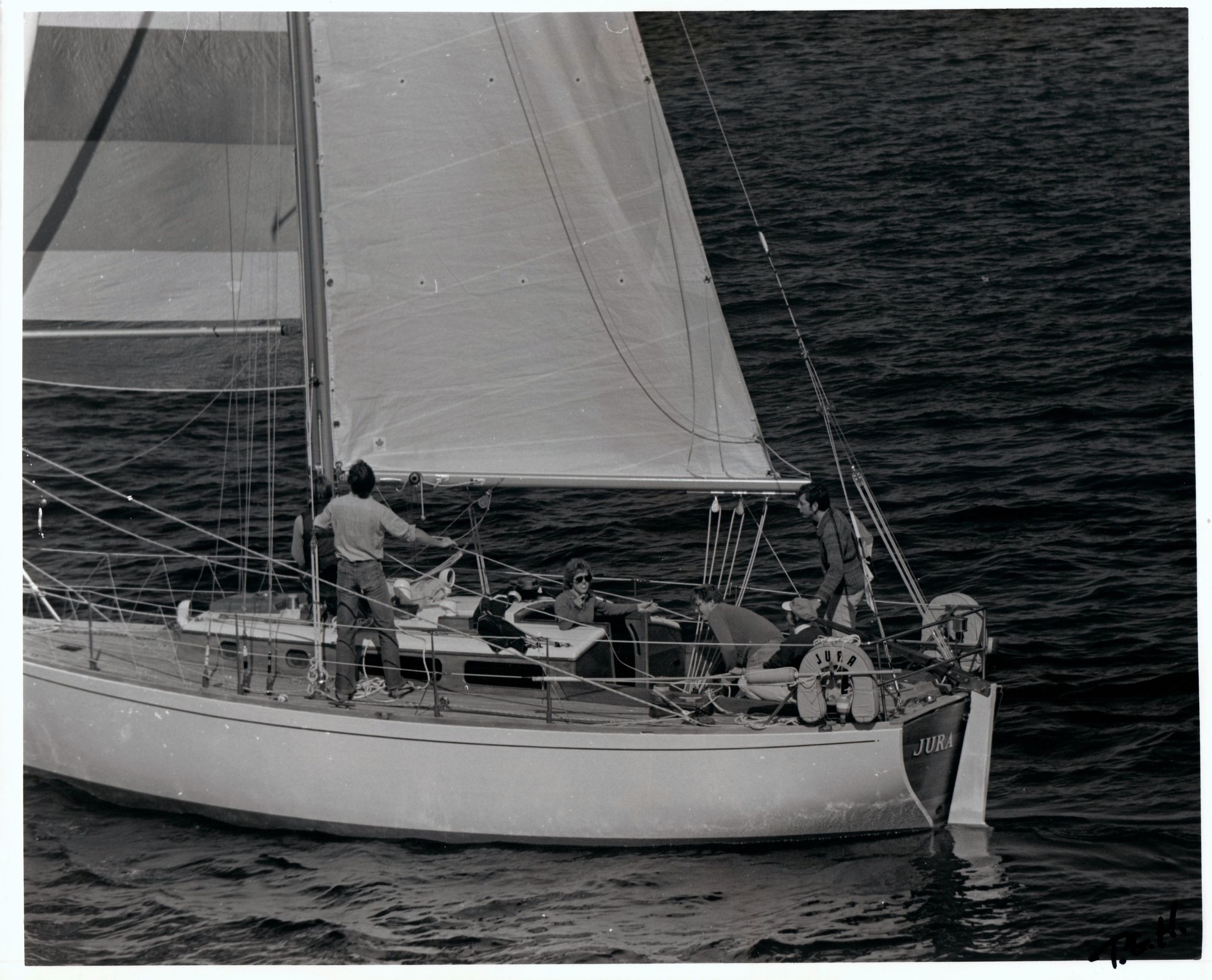Black and white: Jura under sail with crew on deck